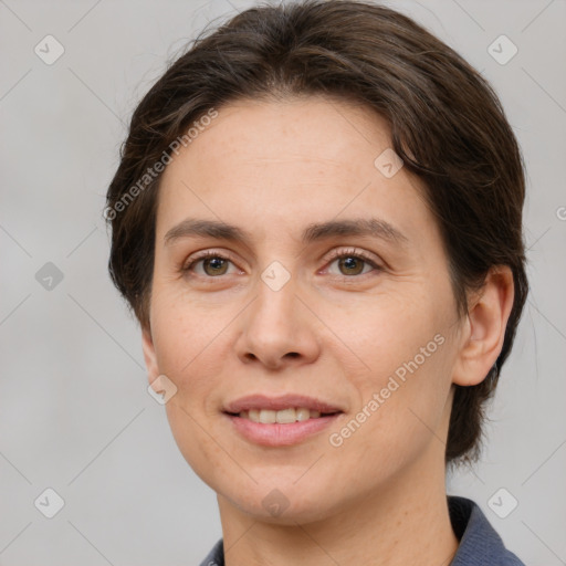 Joyful white adult female with medium  brown hair and grey eyes