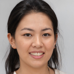 Joyful white young-adult female with medium  brown hair and brown eyes