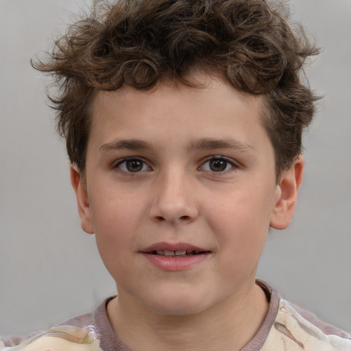 Joyful white child male with short  brown hair and brown eyes