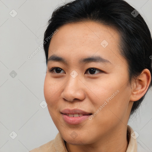 Joyful asian young-adult male with medium  brown hair and brown eyes