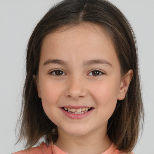 Joyful white child female with medium  brown hair and brown eyes