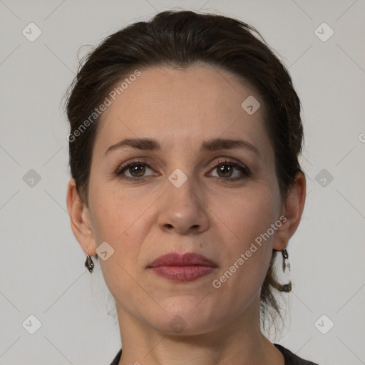 Joyful white adult female with short  brown hair and brown eyes