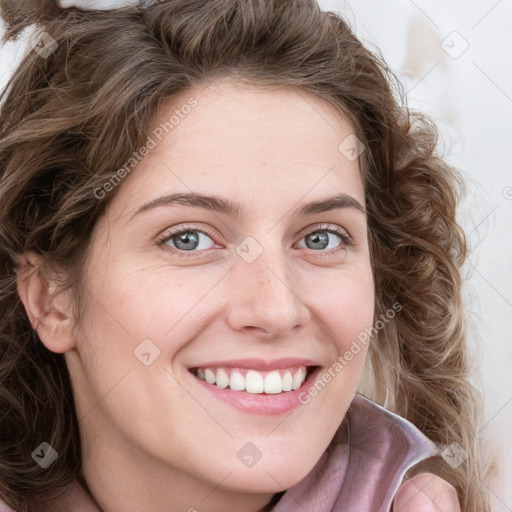 Joyful white young-adult female with long  brown hair and blue eyes