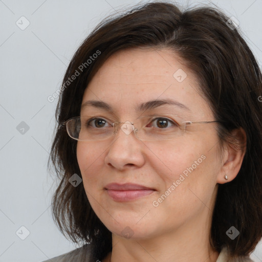 Joyful white adult female with medium  brown hair and brown eyes