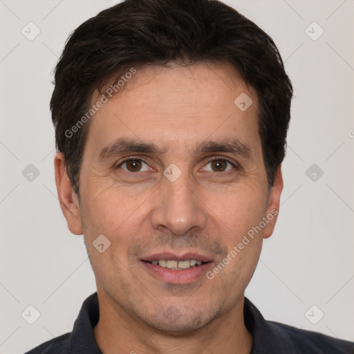 Joyful white adult male with short  brown hair and brown eyes