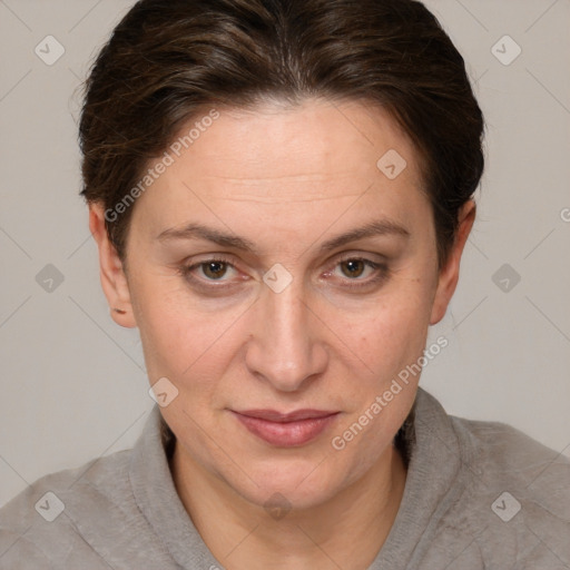 Joyful white adult female with short  brown hair and brown eyes