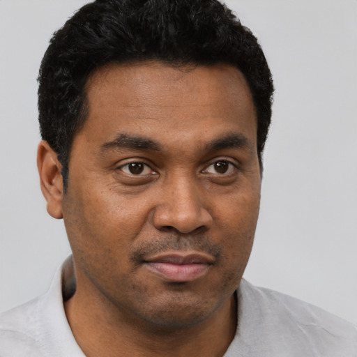 Neutral black young-adult male with short  brown hair and brown eyes