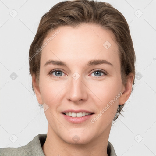 Joyful white young-adult female with short  brown hair and grey eyes