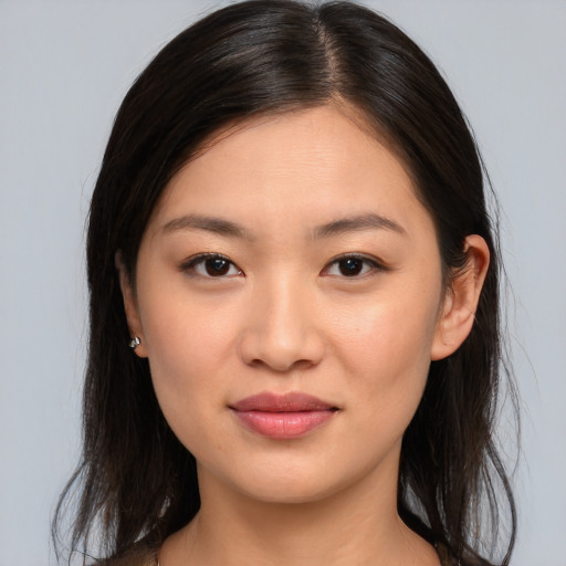 Joyful asian young-adult female with long  brown hair and brown eyes