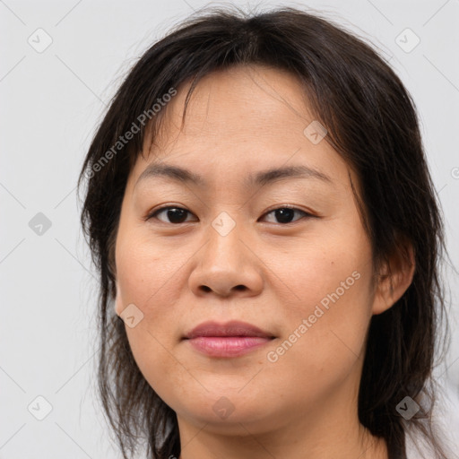 Joyful asian young-adult female with medium  brown hair and brown eyes