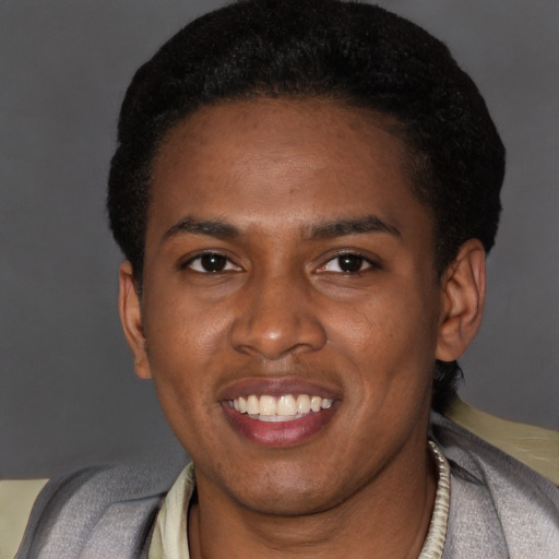 Joyful latino young-adult male with short  black hair and brown eyes