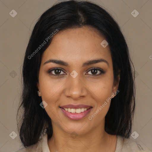 Joyful black young-adult female with long  brown hair and brown eyes