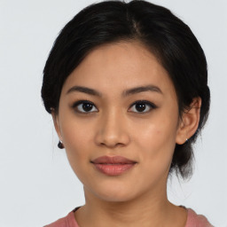 Joyful asian young-adult female with medium  black hair and brown eyes