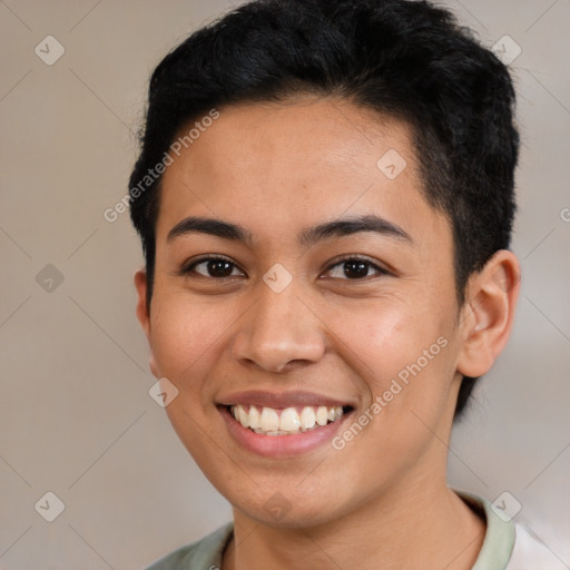 Joyful latino young-adult female with short  brown hair and brown eyes