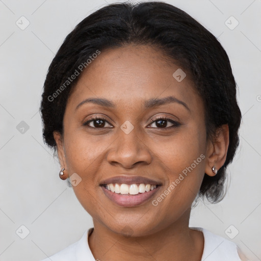 Joyful black young-adult female with medium  brown hair and brown eyes