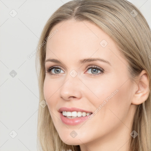 Joyful white young-adult female with long  brown hair and grey eyes