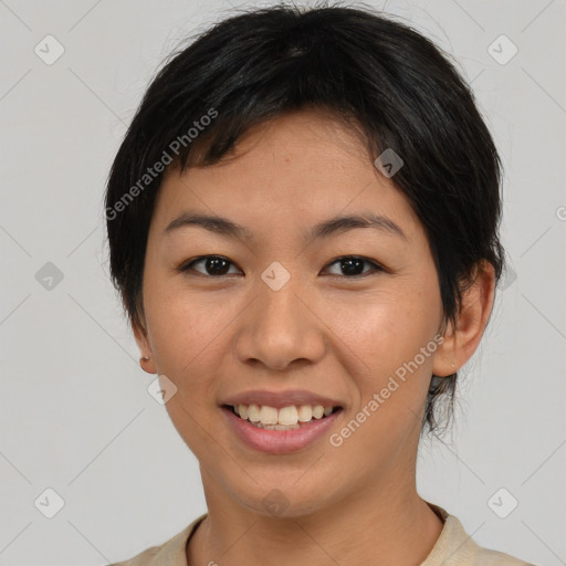 Joyful asian young-adult female with short  black hair and brown eyes