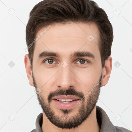 Joyful white young-adult male with short  brown hair and brown eyes