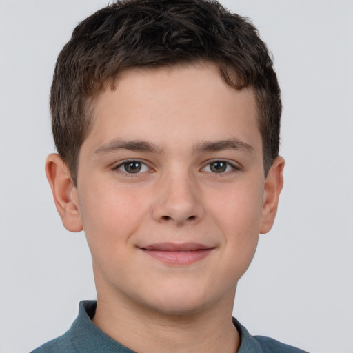 Joyful white child male with short  brown hair and brown eyes