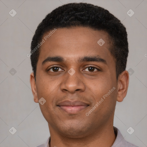 Joyful black young-adult male with short  brown hair and brown eyes