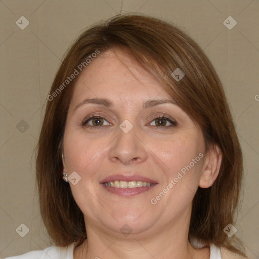 Joyful white adult female with medium  brown hair and green eyes