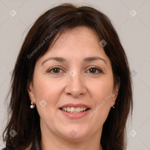 Joyful white adult female with medium  brown hair and brown eyes