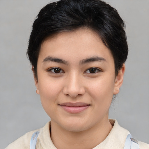 Joyful asian young-adult female with short  brown hair and brown eyes