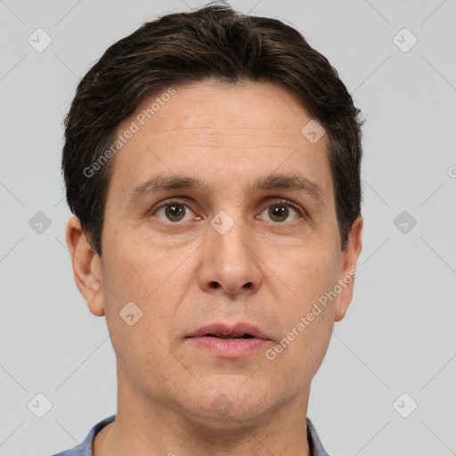 Joyful white adult male with short  brown hair and brown eyes