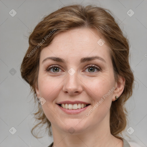 Joyful white young-adult female with medium  brown hair and green eyes