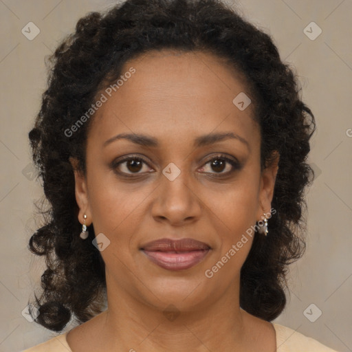 Joyful black adult female with medium  brown hair and brown eyes