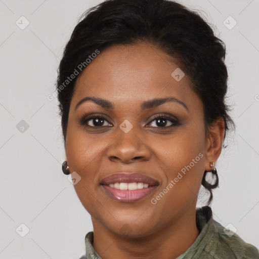 Joyful black young-adult female with long  brown hair and brown eyes