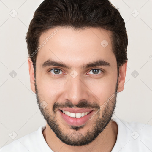 Joyful white young-adult male with short  brown hair and brown eyes