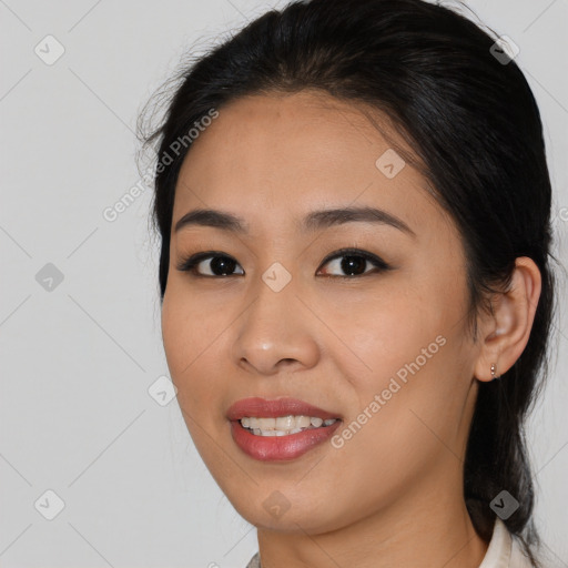 Joyful asian young-adult female with medium  black hair and brown eyes