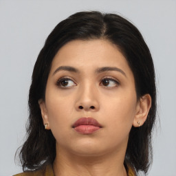 Neutral asian young-adult female with medium  black hair and brown eyes