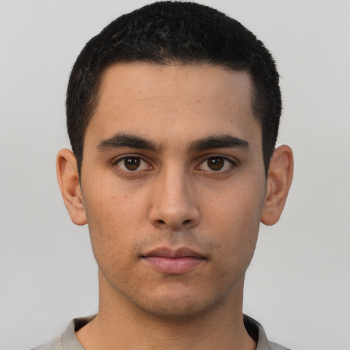 Neutral latino young-adult male with short  black hair and brown eyes