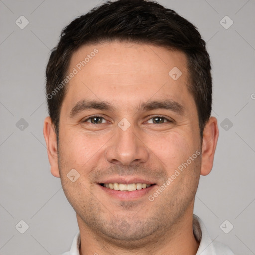 Joyful white young-adult male with short  brown hair and brown eyes