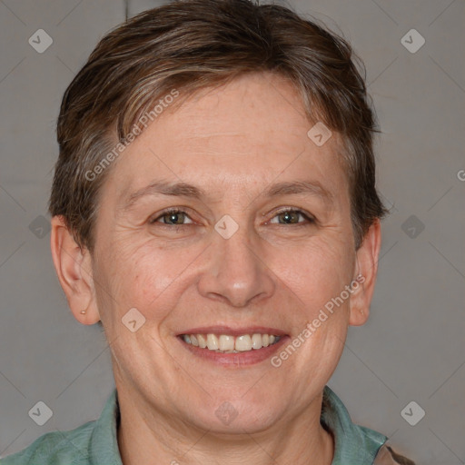 Joyful white adult female with short  brown hair and brown eyes