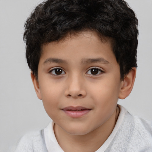 Joyful white child male with short  brown hair and brown eyes