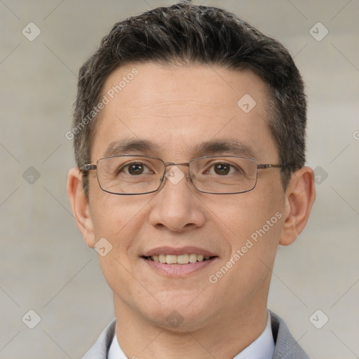 Joyful white adult male with short  brown hair and brown eyes