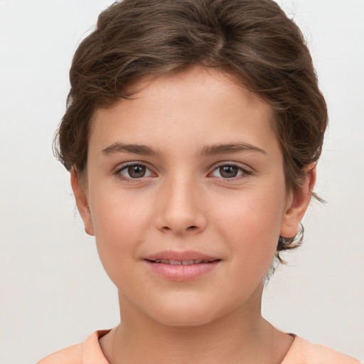 Joyful white child female with short  brown hair and brown eyes