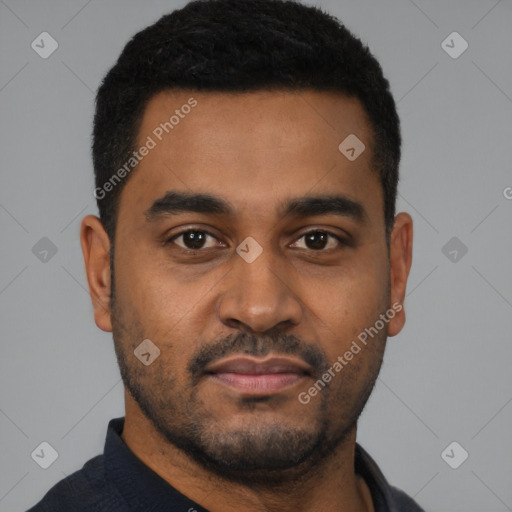 Joyful black young-adult male with short  black hair and brown eyes
