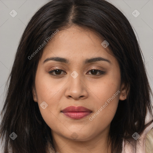 Joyful latino young-adult female with long  brown hair and brown eyes