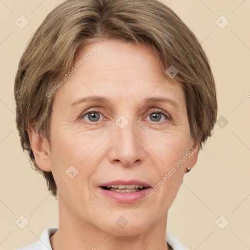 Joyful white adult female with short  brown hair and grey eyes