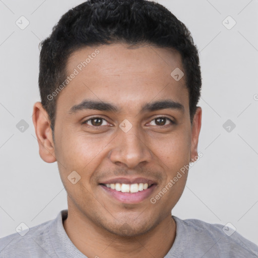 Joyful latino young-adult male with short  brown hair and brown eyes