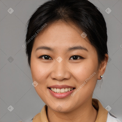 Joyful asian young-adult female with medium  brown hair and brown eyes