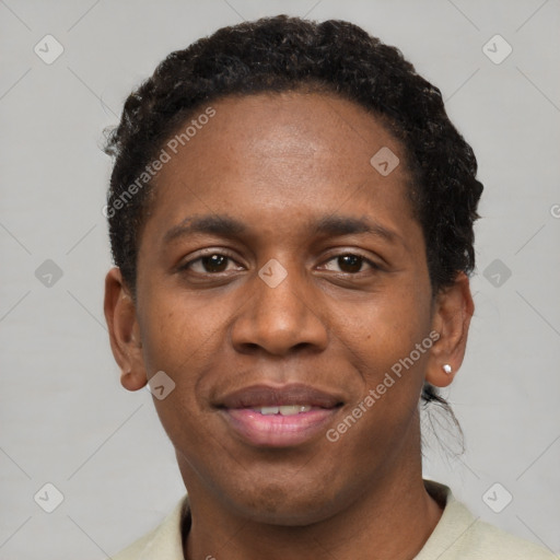 Joyful black young-adult male with short  black hair and brown eyes