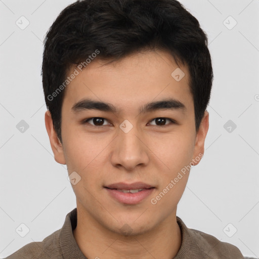 Joyful asian young-adult male with short  brown hair and brown eyes