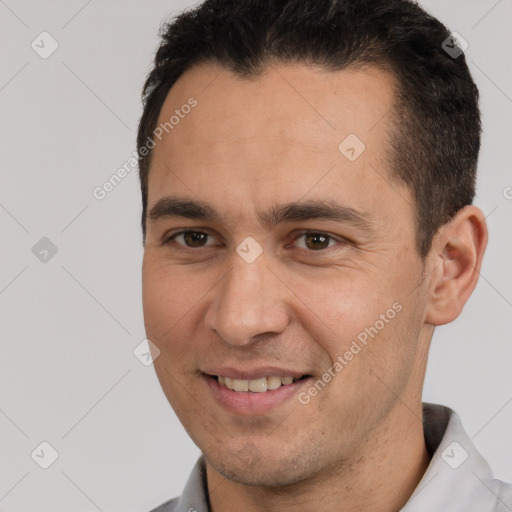 Joyful white adult male with short  brown hair and brown eyes