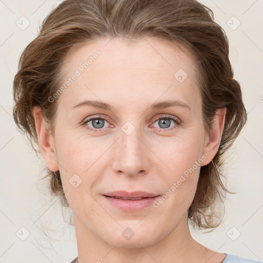 Joyful white young-adult female with medium  brown hair and blue eyes