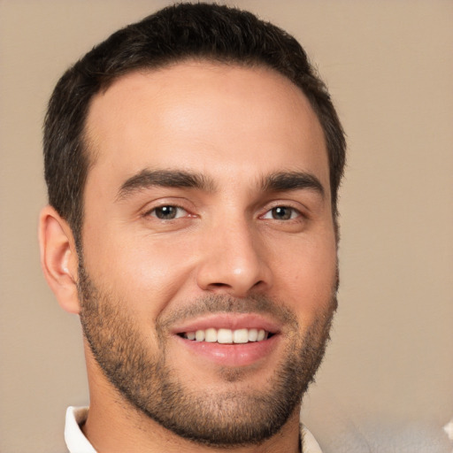 Joyful white young-adult male with short  brown hair and brown eyes